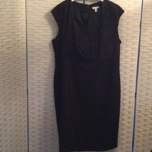 Black dress with fabric flower detail.